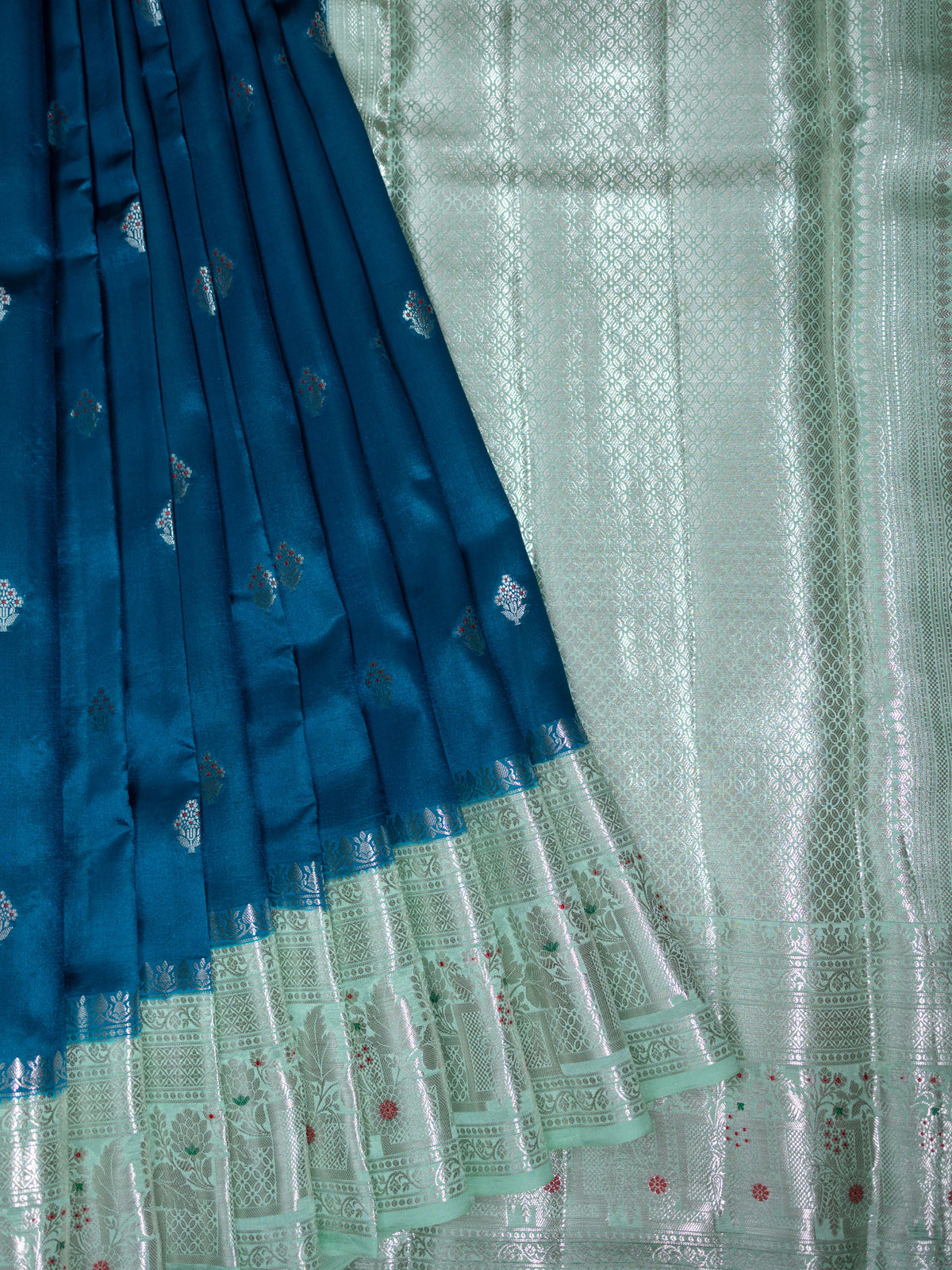 Teal Blue Chiniya Silk Saree With Silver Zari Butta & Pista Green Border
