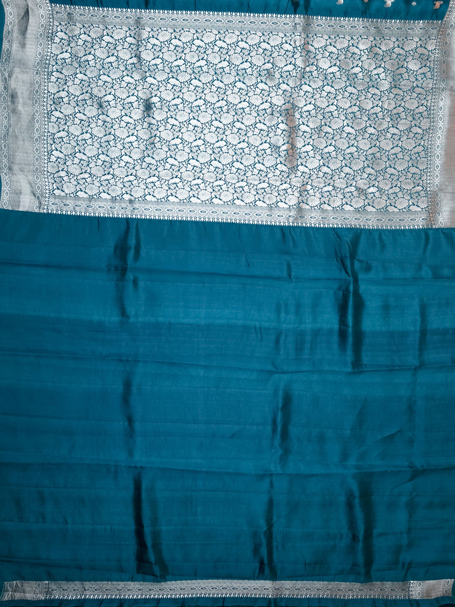 Teal Blue Chiniya Silk Saree With Pichwai Butta Design And Self Gold Zari