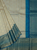 Kanjeevaram Kanchi Pattu All Over Butta Zari With Contrast Border (Talambralu) Cream + Blue